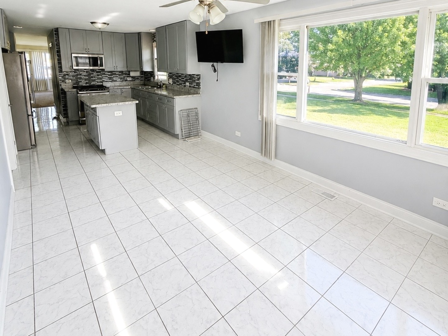 8356 South 78th Avenue Bridgeview, IL 60455 - Photo 16 of 39 a kitchen with stainless steel appliances a stove a sink and a refrigerator