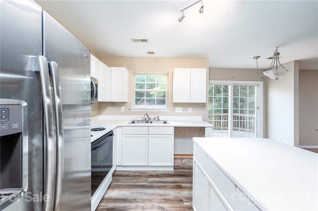 840 Knightsbridge Road Fort Mill, SC 29708 - Photo 11 of 32 a view of a kitchen with a sink stove and refrigerator