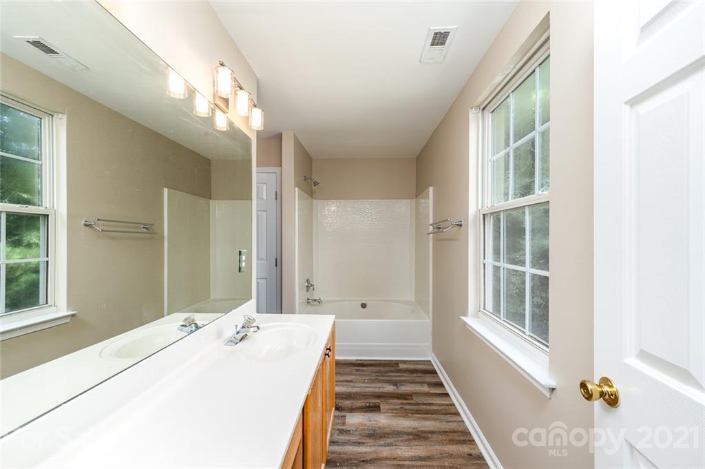 840 Knightsbridge Road Fort Mill, SC 29708 - Photo 17 of 32 a spacious bathroom with a tub sink and mirror