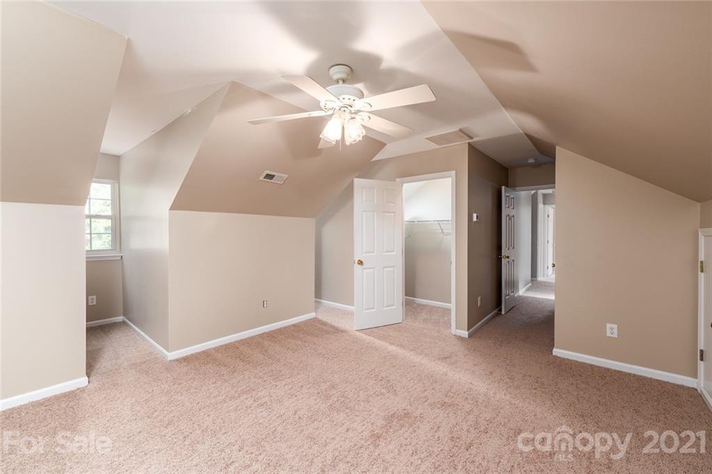 840 Knightsbridge Road Fort Mill, SC 29708 - Photo 21 of 32 a view of an empty room with a ceiling fan