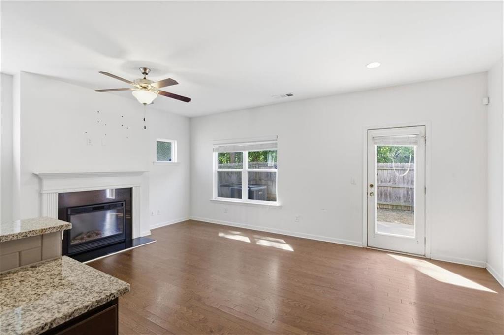 5064 Longview Walk Decatur, GA 30035 - Photo 12 of 30 a view of an empty room with a fireplace and a window