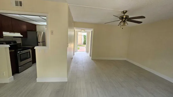 a view of a kitchen from the hallway