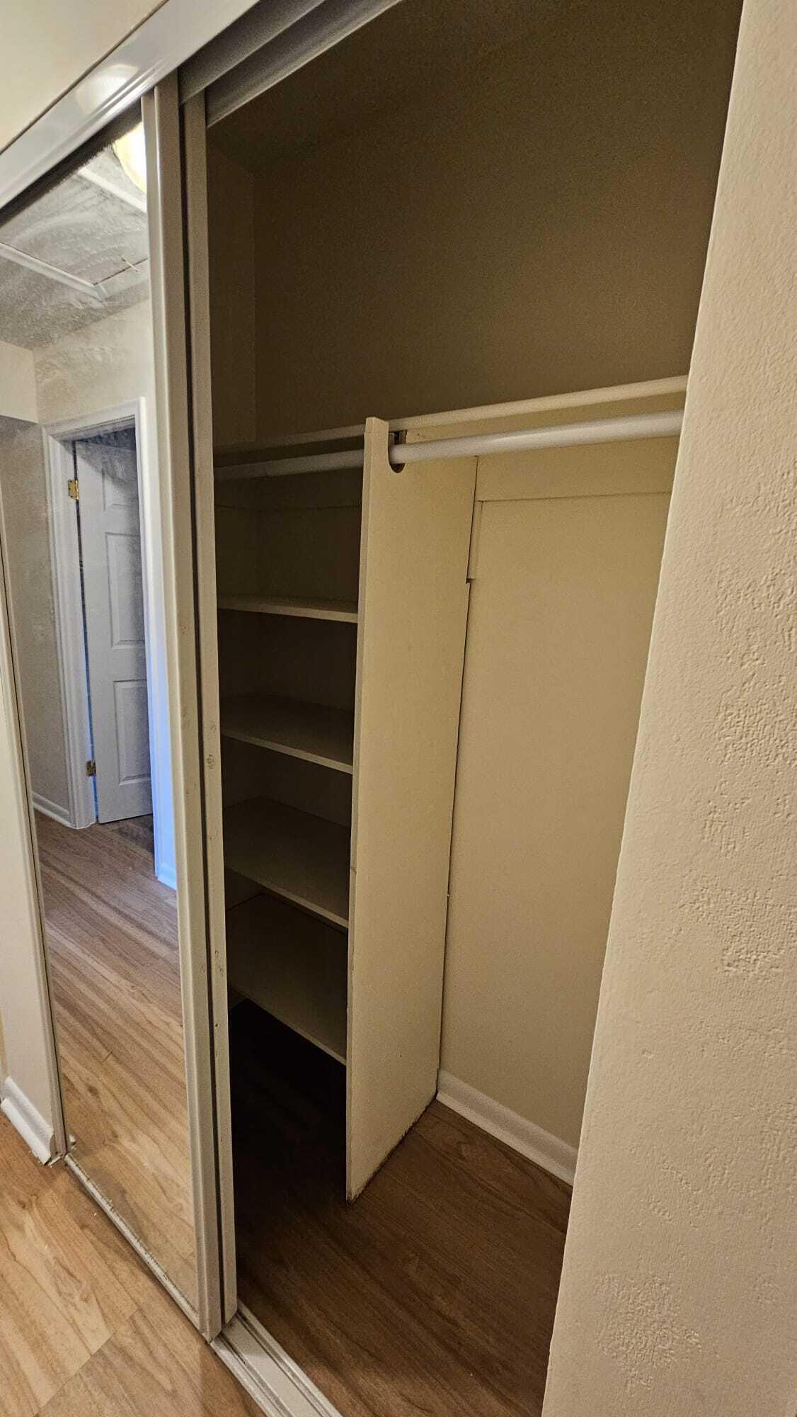8801 West Sample Road, Unit 11 Coral Springs, FL 33065 - Photo 20 of 25 a view of walk in closet with empty racks