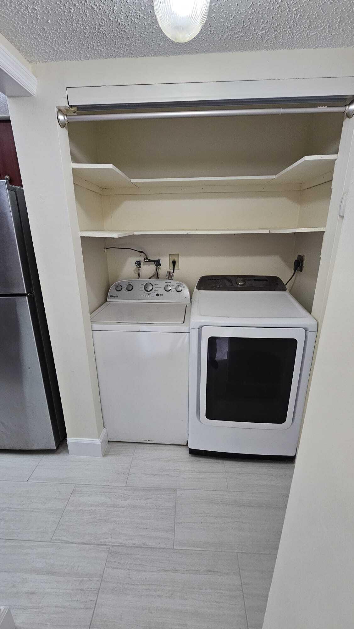 8801 West Sample Road, Unit 11 Coral Springs, FL 33065 - Photo 23 of 25 a utility room with washer and dryer