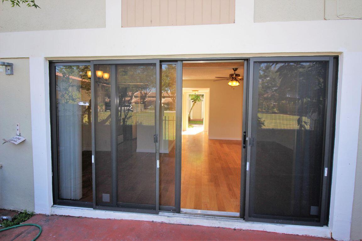 8801 West Sample Road, Unit 11 Coral Springs, FL 33065 - Photo 24 of 25 a view of a bathroom with glass door