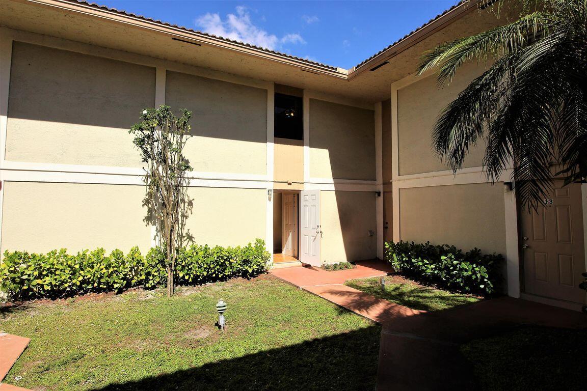 8801 West Sample Road, Unit 11 Coral Springs, FL 33065 - Photo 3 of 25 a view of a backyard of the house