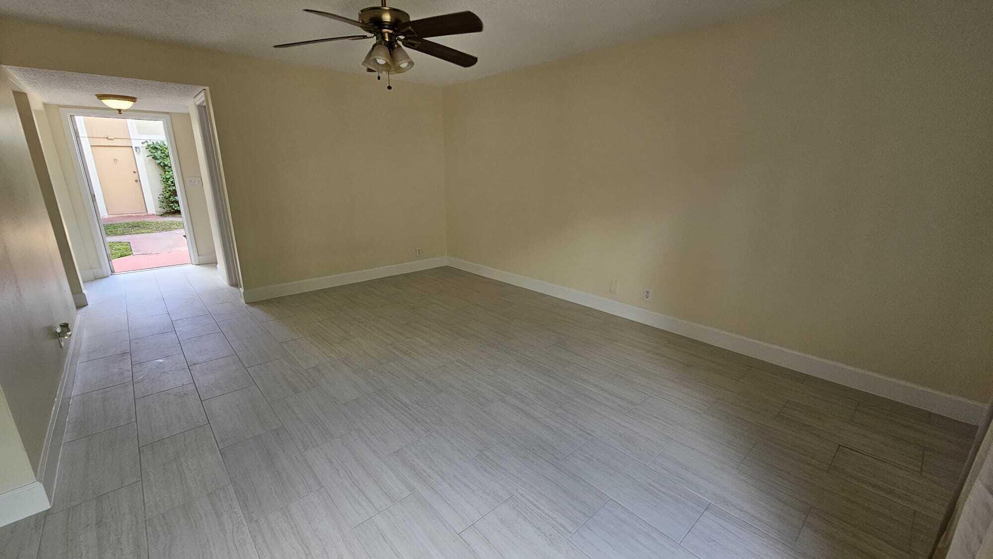 8801 West Sample Road, Unit 11 Coral Springs, FL 33065 - Photo 5 of 25 an empty room with a window