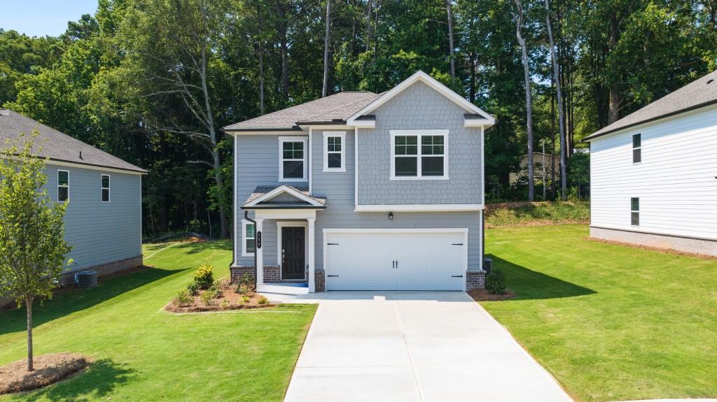 659 Evergreen Road Winder, GA 30680 - Photo 1 of 1 a view of a house with a yard patio and a small yard