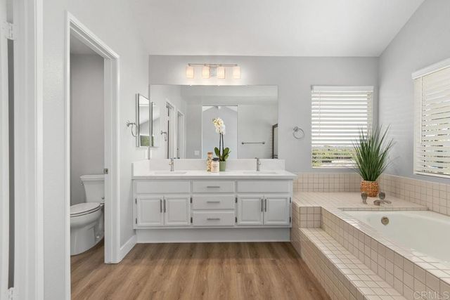 a bathroom with a bathtub and a sink