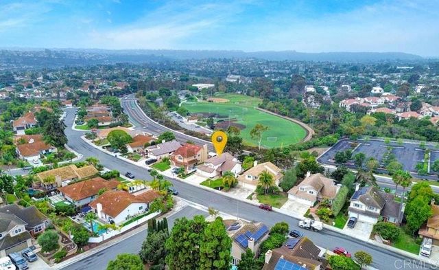 a view of house with outdoor space and sitting area