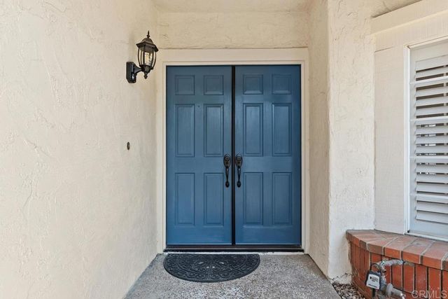 a kitchen with stainless steel appliances a refrigerator stove and cabinets
