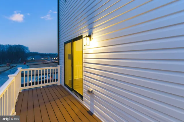 a view of balcony with wooden floor