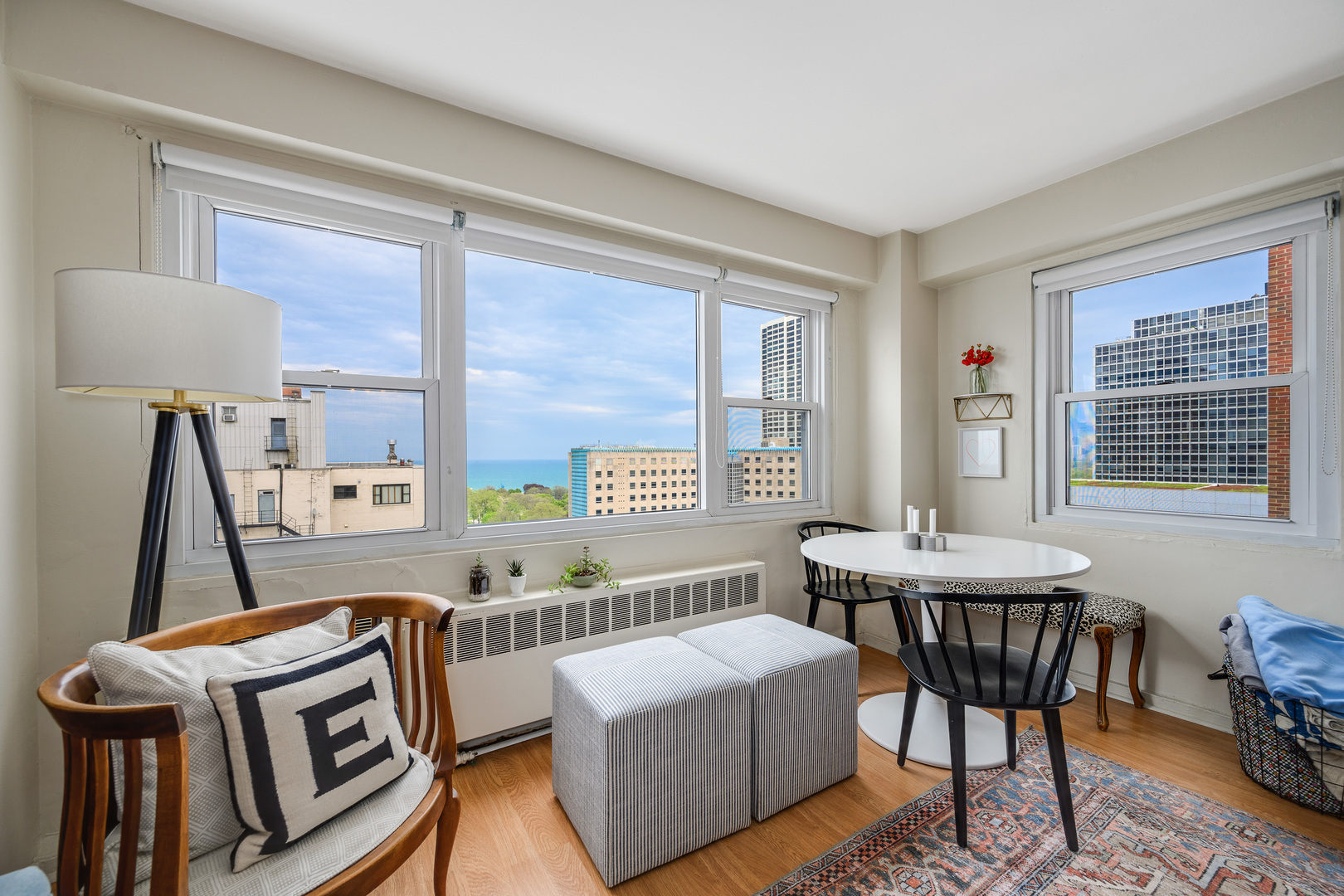 2909 North Sheridan Road, Unit 1803 Chicago, IL 60657 - Photo 3 of 16 a living room with furniture and a window