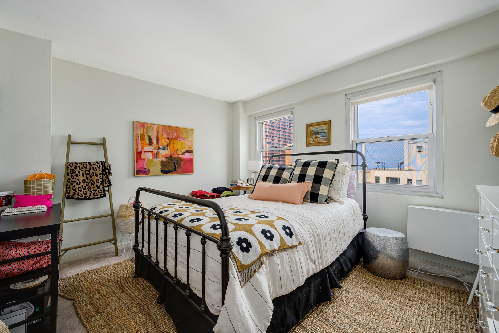 2909 North Sheridan Road, Unit 1803 Chicago, IL 60657 - Photo 9 of 16 a bedroom with a bed and a chandelier