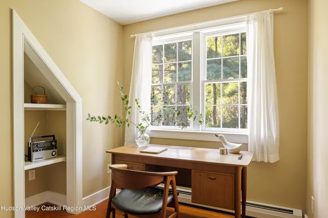 a room with a table and chairs in it
