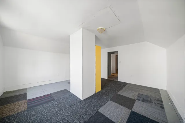 a view of hallway with wooden floor