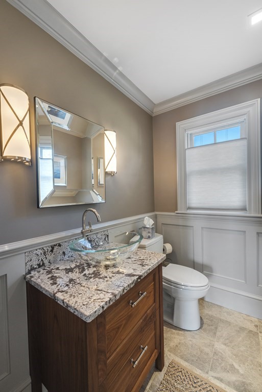 15 Spray Avenue Marblehead, MA 01945 - Photo 14 of 42 a bathroom with a granite countertop toilet sink and mirror