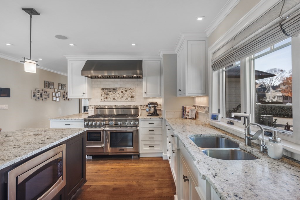 15 Spray Avenue Marblehead, MA 01945 - Photo 19 of 42 a kitchen with stainless steel appliances granite countertop a stove and a sink