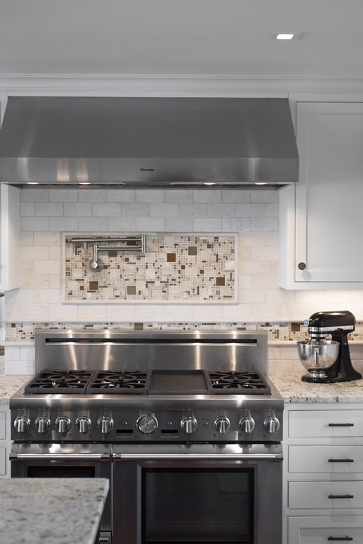 15 Spray Avenue Marblehead, MA 01945 - Photo 21 of 42 a stove top oven sitting inside of a kitchen