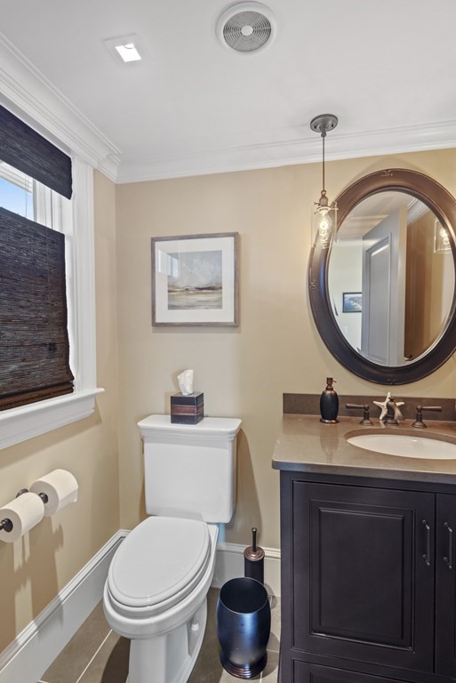 15 Spray Avenue Marblehead, MA 01945 - Photo 23 of 42 a bathroom with a toilet a sink and a mirror