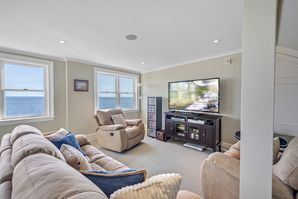 15 Spray Avenue Marblehead, MA 01945 - Photo 37 of 42 a living room with furniture and a flat screen tv