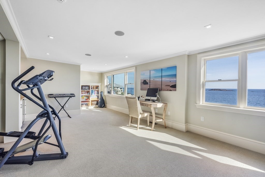 15 Spray Avenue Marblehead, MA 01945 - Photo 39 of 42 a view of a livingroom with furniture and a gym equipment