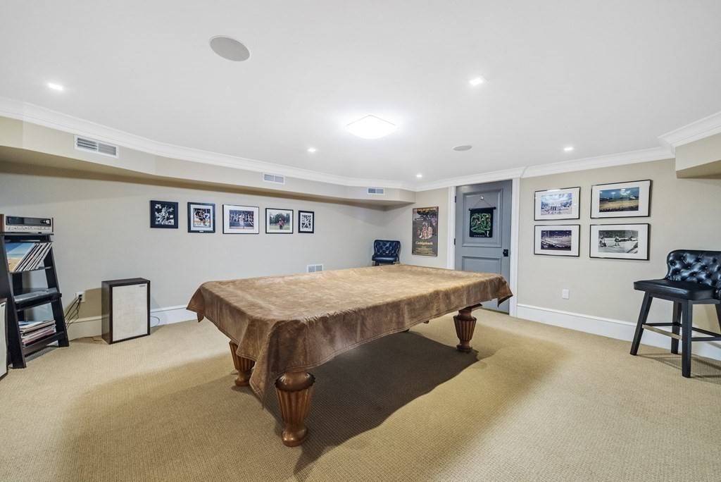 15 Spray Avenue Marblehead, MA 01945 - Photo 42 of 42 a spacious bedroom with a bed and a table in it