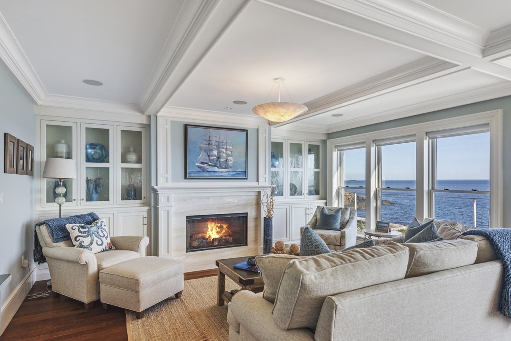 15 Spray Avenue Marblehead, MA 01945 - Photo 9 of 42 a living room with furniture large window and a fireplace
