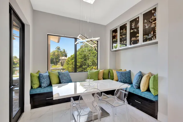 a kitchen with stainless steel appliances kitchen island granite countertop a refrigerator and a stove top oven