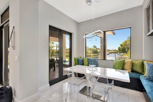 a kitchen with kitchen island granite countertop a sink stove and cabinets