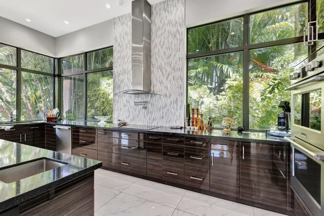a dining room with furniture a flat screen tv and a large window