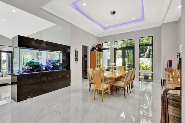 a view of a livingroom with a window and a chandelier
