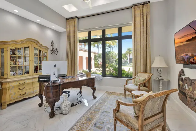 an aerial view of a house with a yard and garden