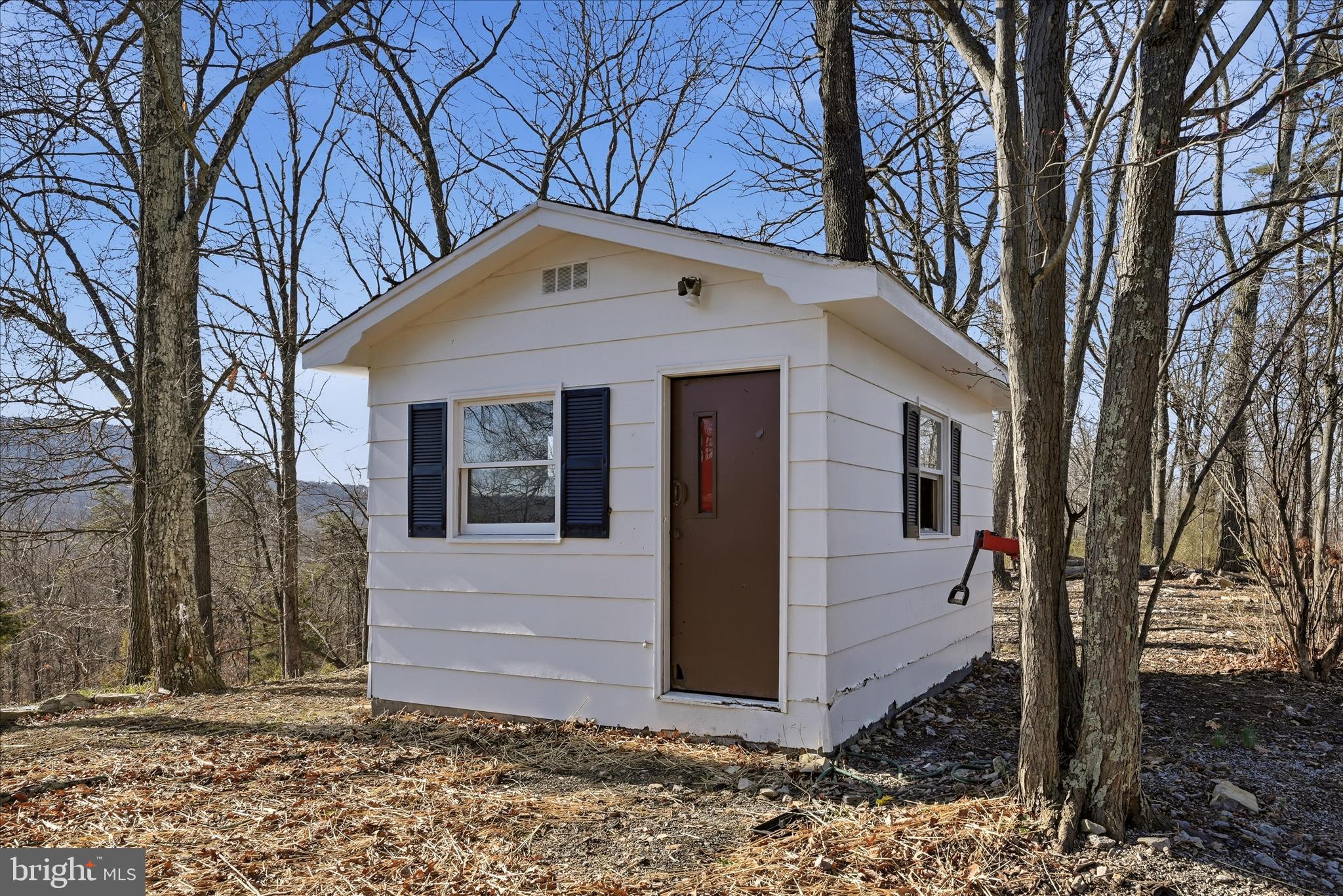 2280 Pine Grove Road Berkeley Springs, WV 25411 - Photo 48 of 59 a front view of a house with garden