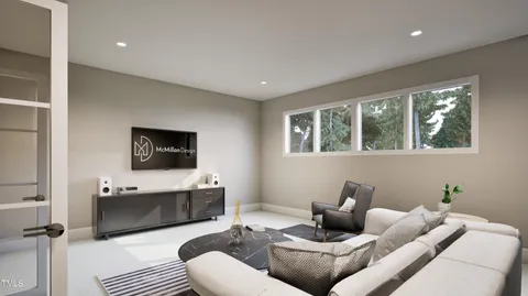 a bedroom with a bed couch and window