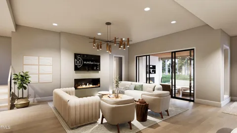 a living room with furniture a large window and kitchen view