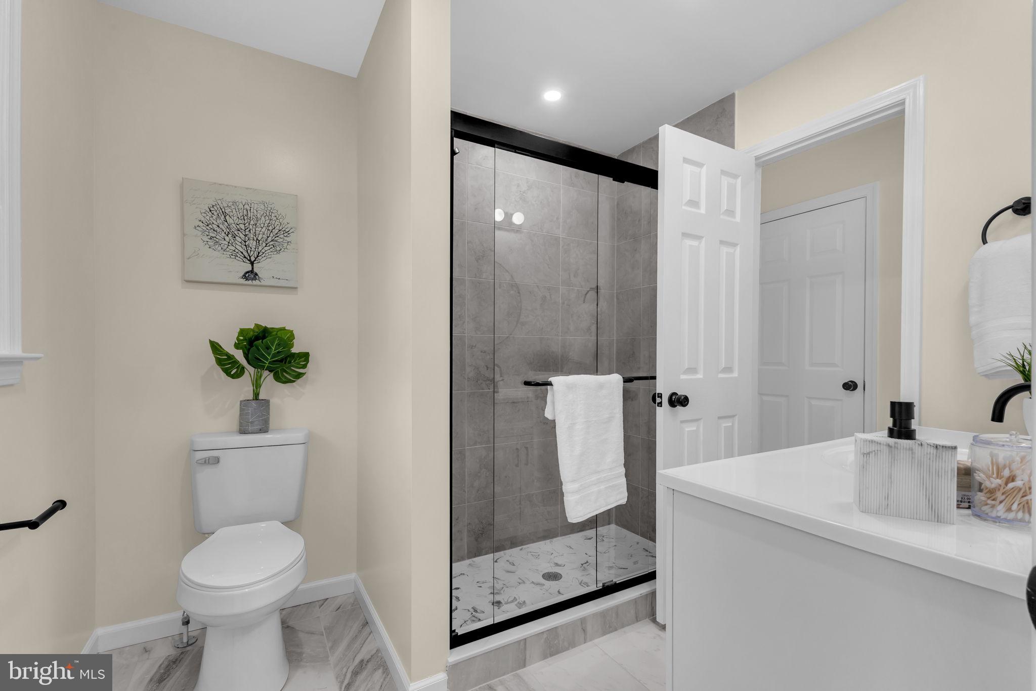 6400 Inwood Drive Springfield, VA 22150 - Photo 20 of 37 a bathroom with a toilet sink and shower