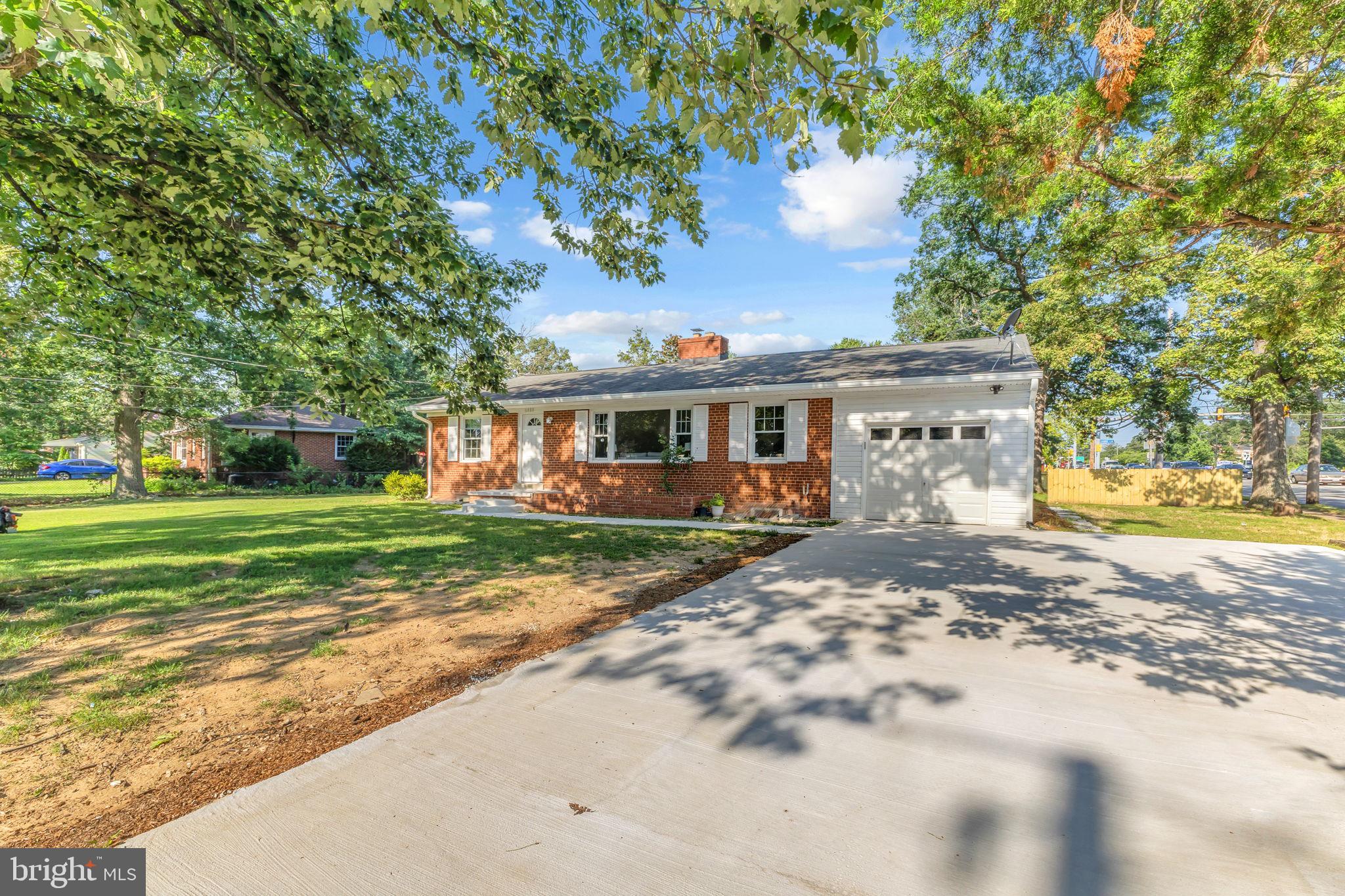 6400 Inwood Drive Springfield, VA 22150 - Photo 2 of 37 a front view of a house with a yard