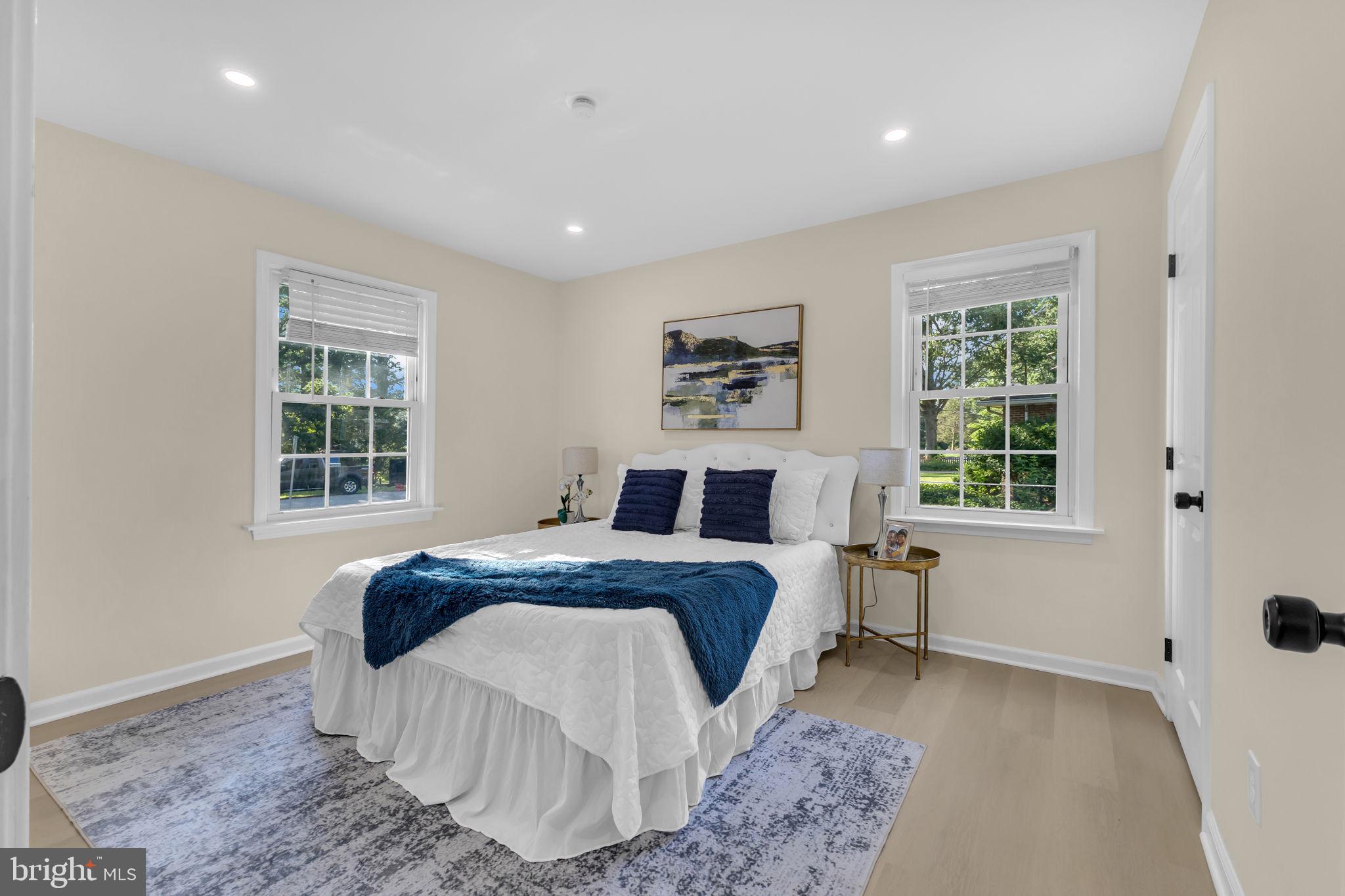 6400 Inwood Drive Springfield, VA 22150 - Photo 21 of 37 a bed sitting in a spacious bedroom next to a window