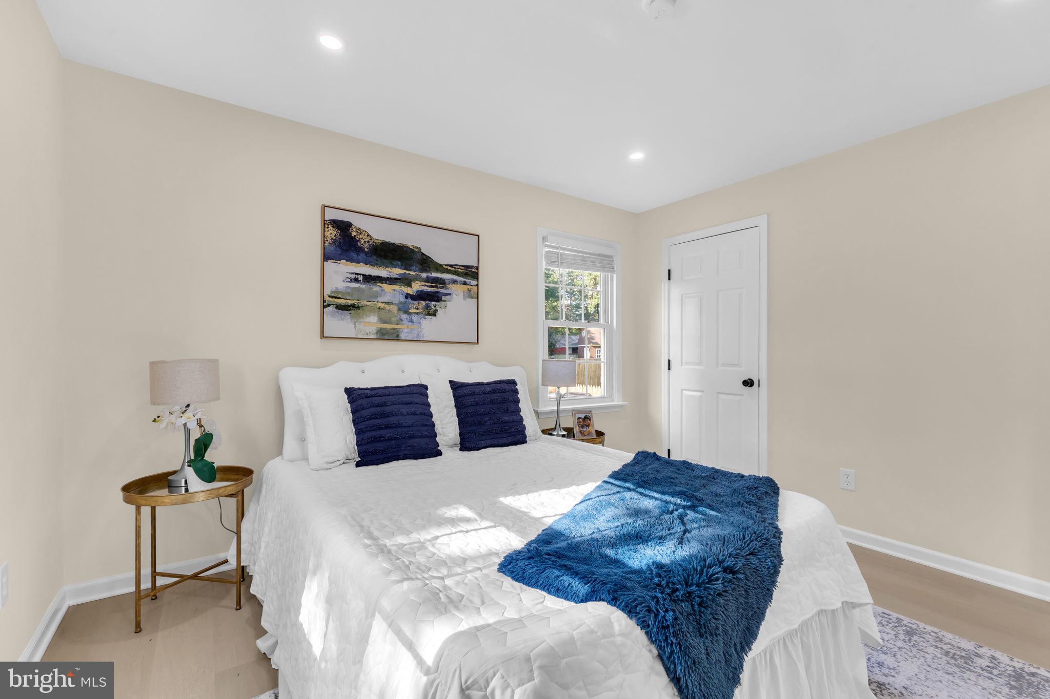 6400 Inwood Drive Springfield, VA 22150 - Photo 22 of 37 a bedroom with a large bed and a chair