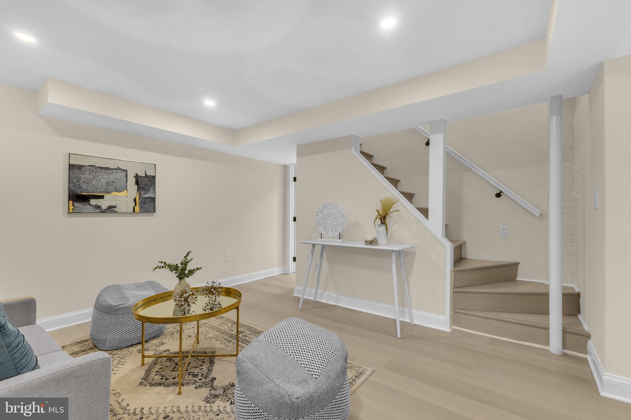 6400 Inwood Drive Springfield, VA 22150 - Photo 24 of 37 a living room with furniture and a potted plant