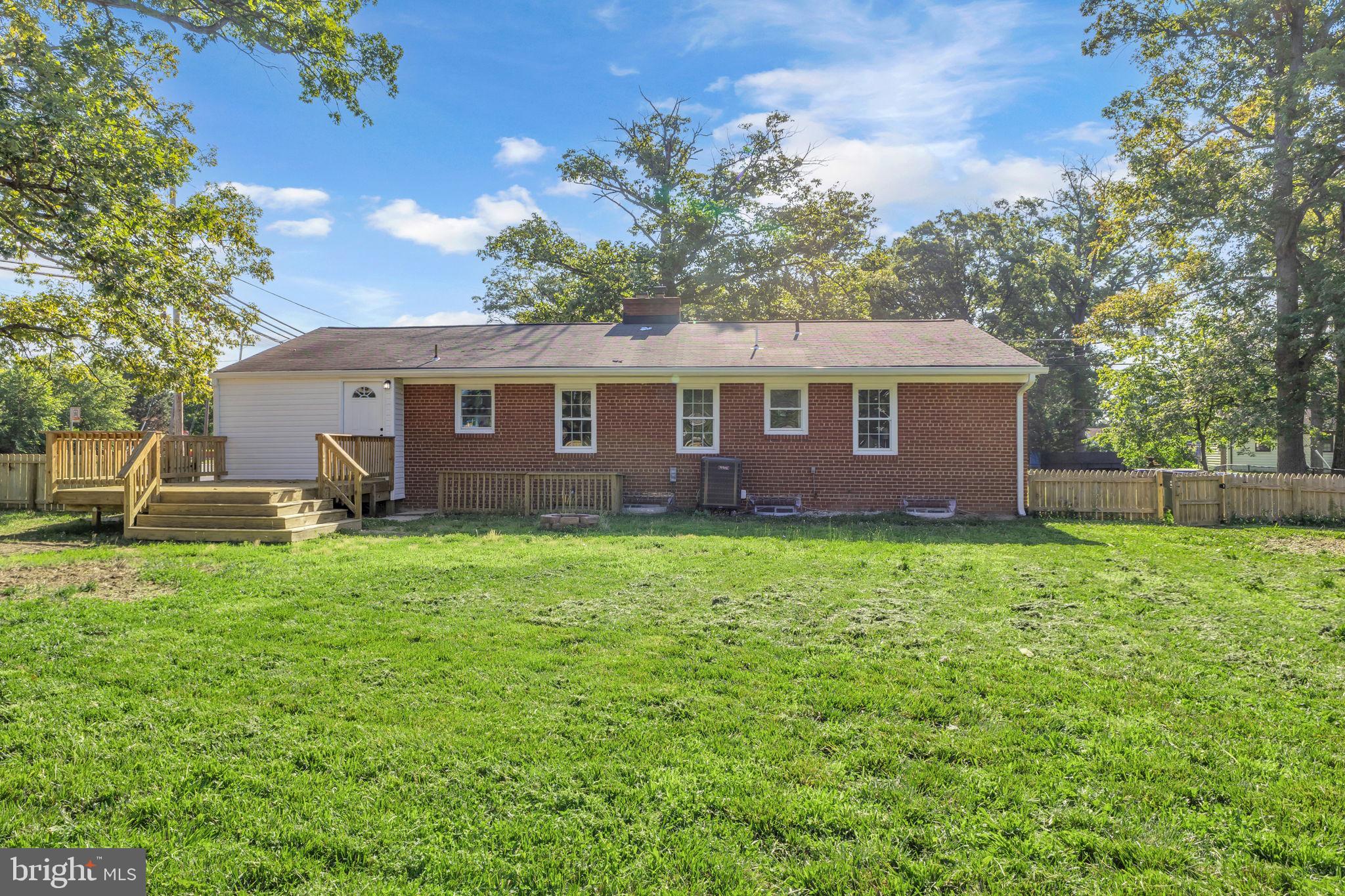 6400 Inwood Drive Springfield, VA 22150 - Photo 36 of 37 a view of a yard in front of a house with large trees