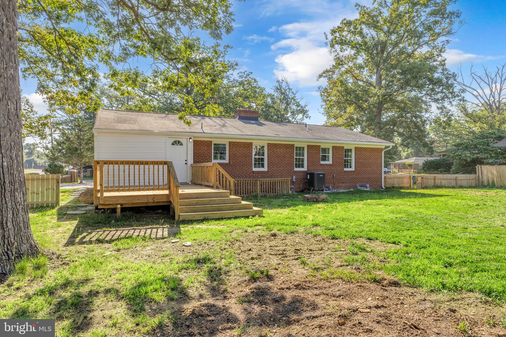 6400 Inwood Drive Springfield, VA 22150 - Photo 37 of 37 a view of a house with a backyard and a garden