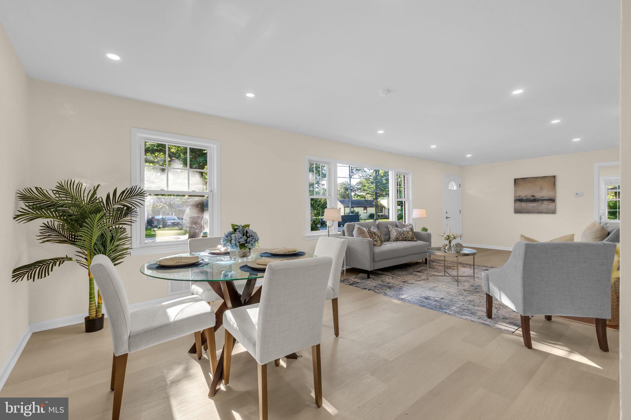 6400 Inwood Drive Springfield, VA 22150 - Photo 6 of 37 a view of a dining room with furniture and a potted plant