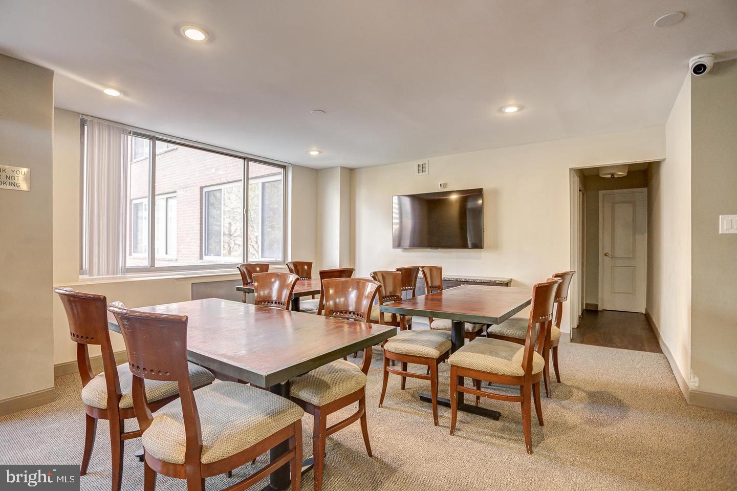 1121 Arlington Boulevard, Unit 218 Arlington, VA 22209 - Photo 19 of 32 a view of a dining room with furniture and a window