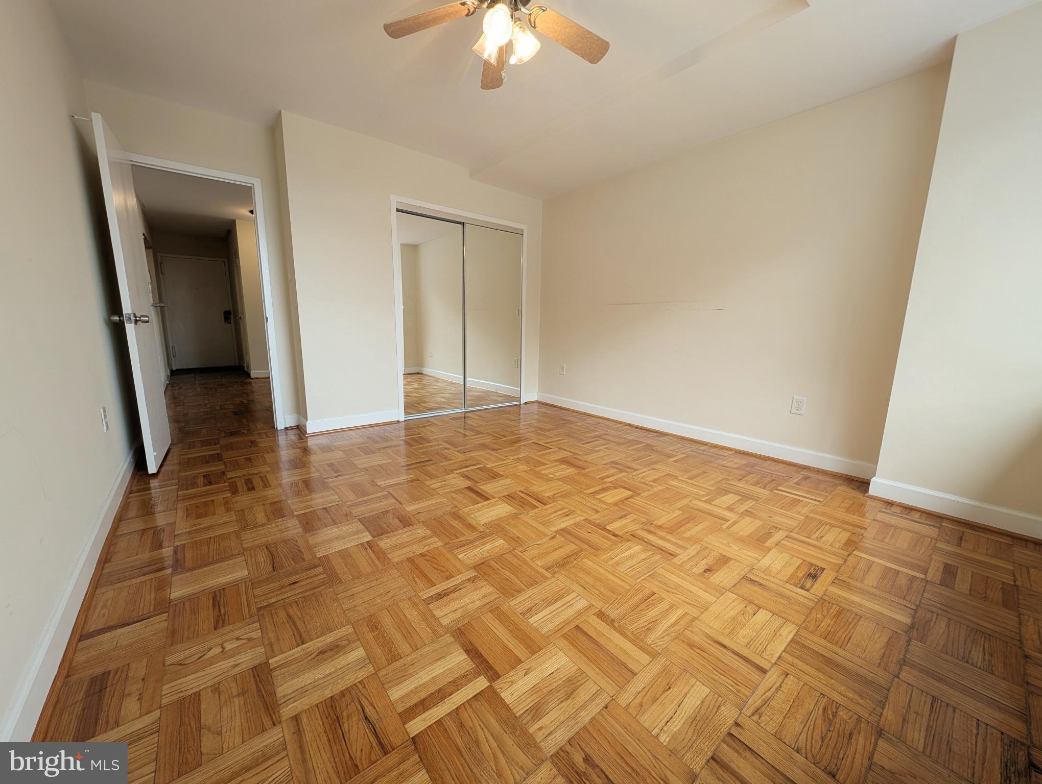 1121 Arlington Boulevard, Unit 218 Arlington, VA 22209 - Photo 10 of 32 a view of an empty room and chandelier fan