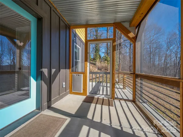 a view of a balcony with wooden floor