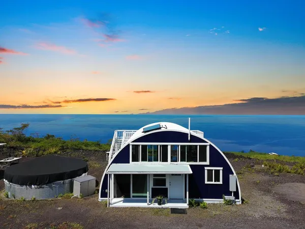 a front view of a house with ocean view