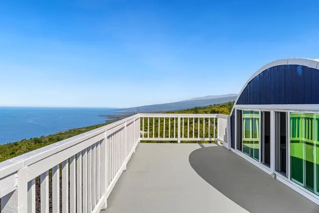 a view of balcony with furniture