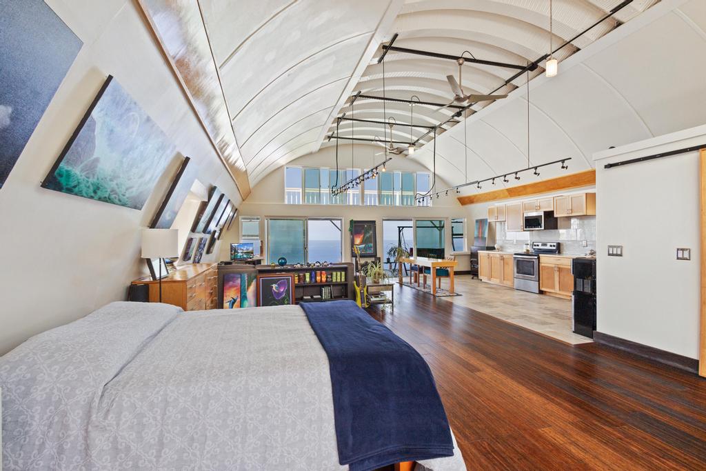 87-4521 Keahi Kai Place Captain Cook, HI 96704 - Photo 18 of 22 a view of a living room with furniture wooden floor and chandelier